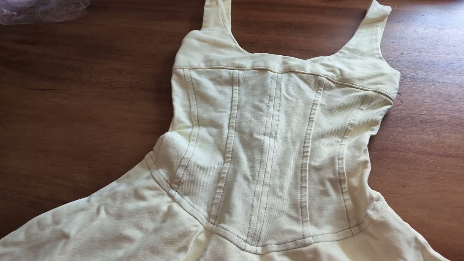 A paneled garment sample on a factory worktable